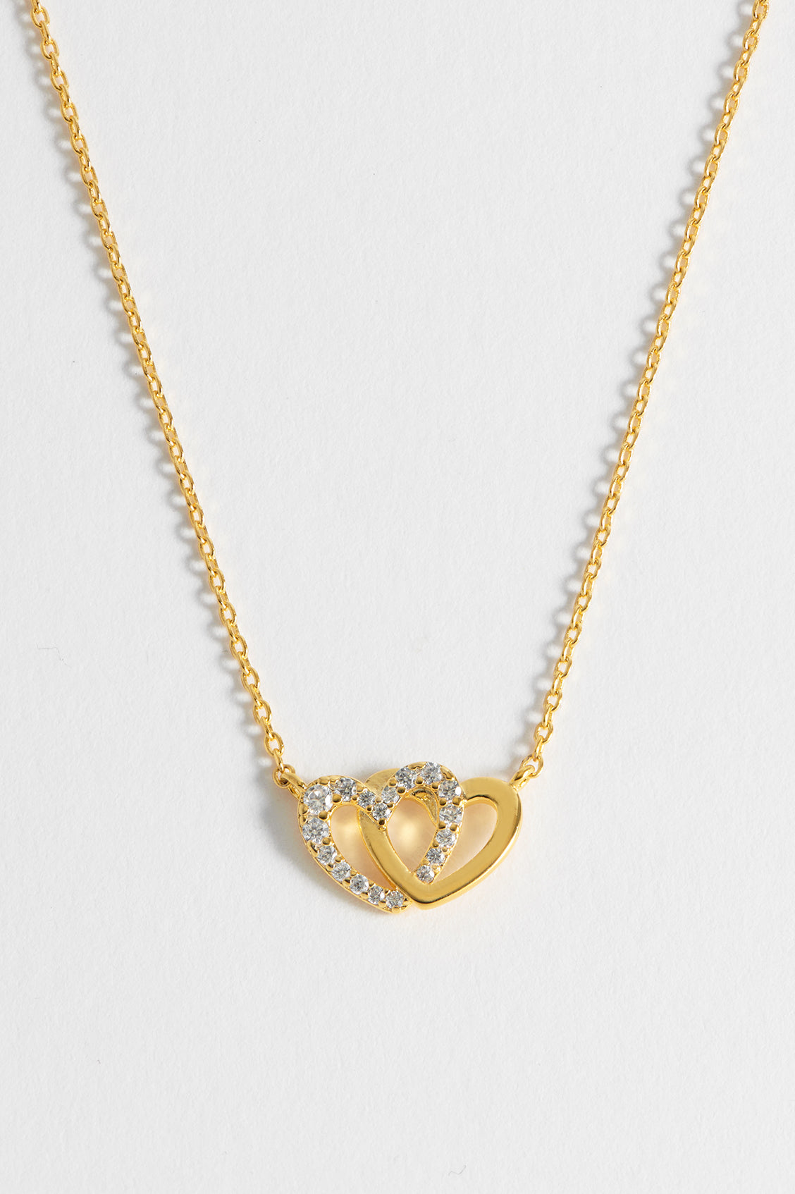 Interlocking heart necklace on sale gold