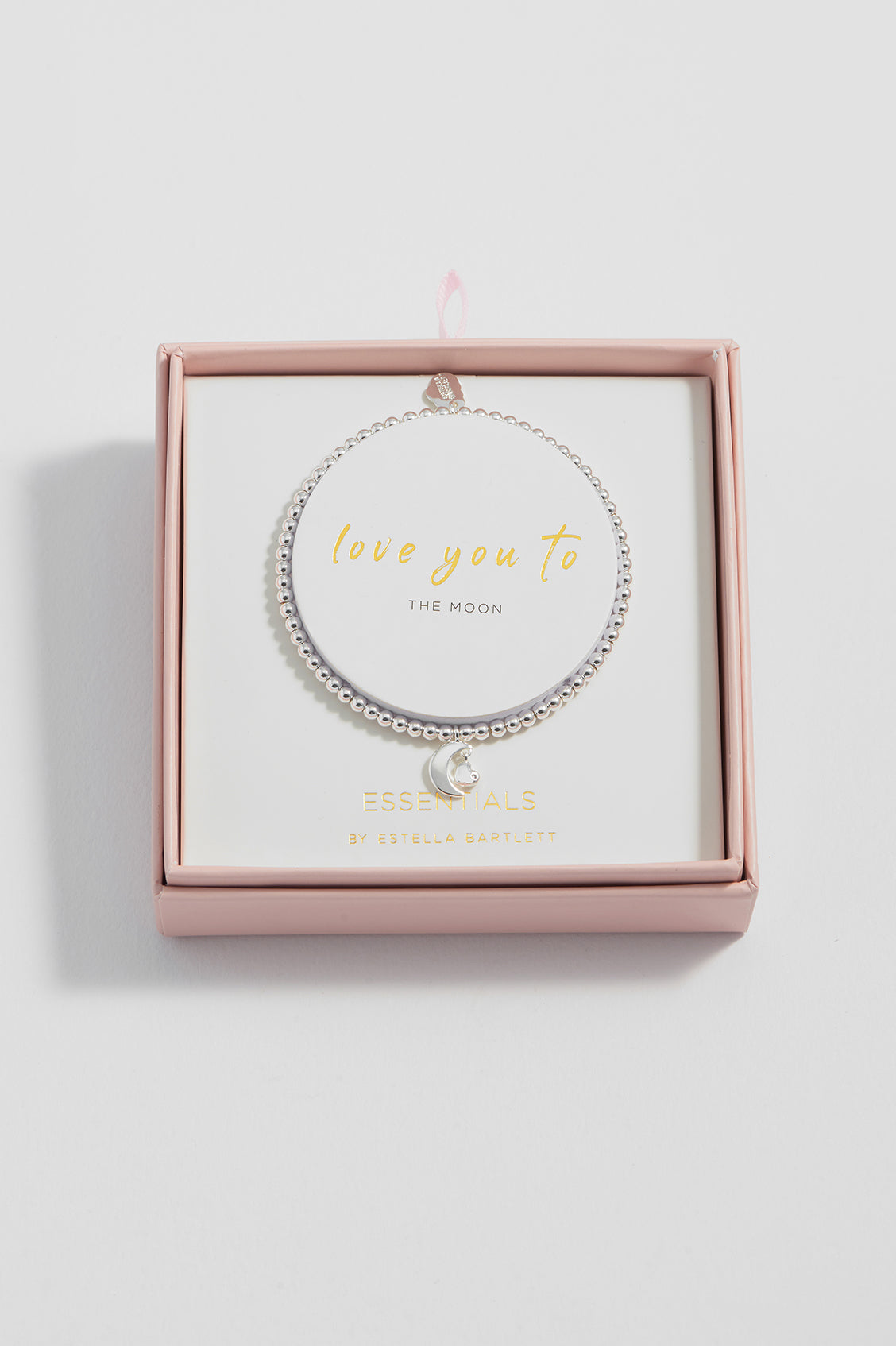 Silver bracelet with 'love you to the moon' text in a pink box on a light gray background