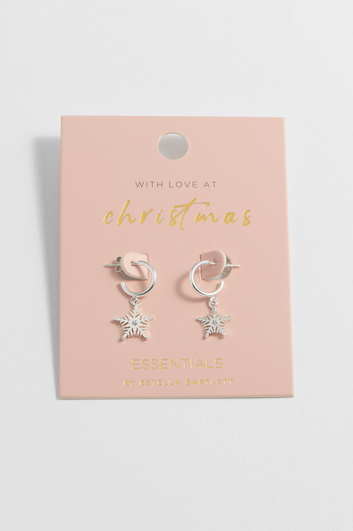 Silver hoop earrings with star details on a pink card with gold text.